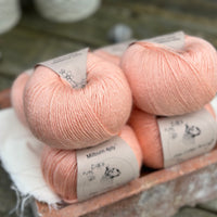 Balls of peachy orange yarn