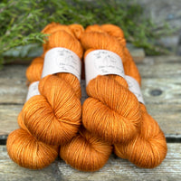 Five skeins of orange yarn