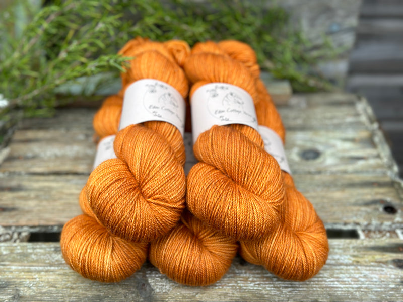 Five skeins of orange yarn