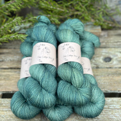 Five skeins of blue-green yarn