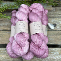 Five skeins of pinky purple yarn