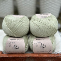 Balls of pale green yarn