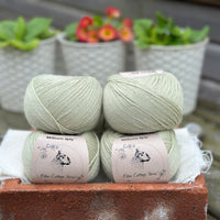 Balls of pale green yarn