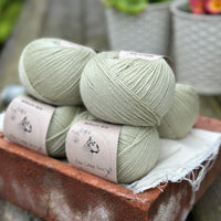 Balls of pale green yarn