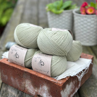 Balls of pale green yarn
