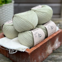 Balls of pale green yarn
