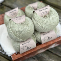 Balls of pale green yarn