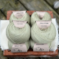 Balls of pale green yarn