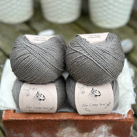 Balls of grey yarn