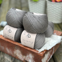 Balls of grey yarn