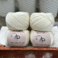 Balls of natural cream coloured yarn