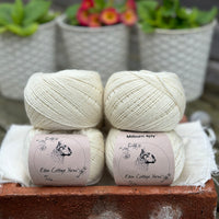 Balls of natural cream coloured yarn