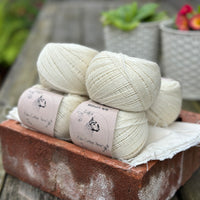 Balls of natural cream coloured yarn