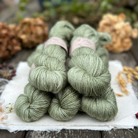Five skeins of green yarn