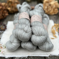 Five skeins of grey yarn