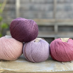 Four balls of Milburn in shades of pink and purple