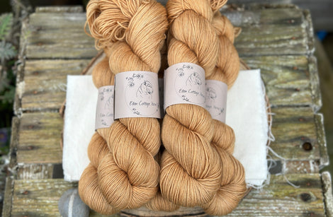 Five skeins of light brown yarn