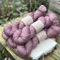 Fives skeins of purple yarn