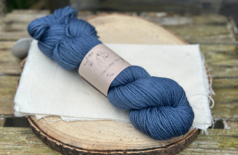 One skein of dark blue yarn