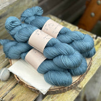 Five skeins of blue yarn