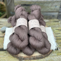 Five skeins of dark brown yarn