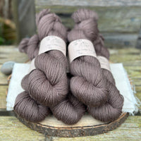 Five skeins of dark brown yarn