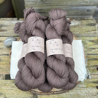 Five skeins of dark brown yarn