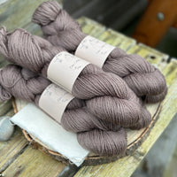 Five skeins of dark brown yarn