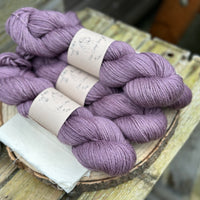 Four skeins of purple yarn