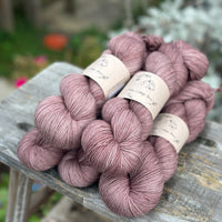 Five skeins of rosy brown yarn