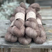 Five skeins of mid-brown yarn
