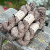 Five skeins of mid-brown yarn