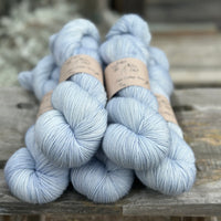 Five skeins of pale blue yarn