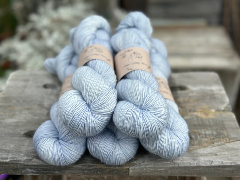 Five skeins of pale blue yarn