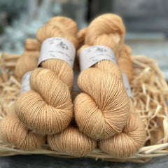 Five skeins of golden brown yarn