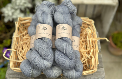 Five skeins of grey-blue yarn