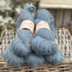 Five skeins of dark blue fluffy yarn