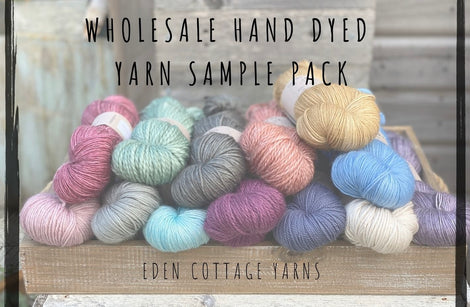 A pile of yarns in different bases and colours. "Wholesale Hand Dyed Yarn Sample Pack" is overlaid in black text at the top of the image. "Eden Cottage Yarns" is overlaid at the bottom of the image.