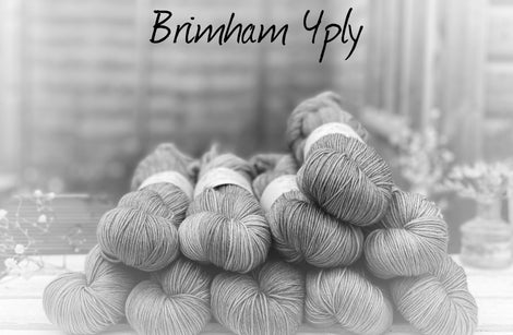 Black and white image of skeins of yarn with "Brimham 4ply" overlaid in black text