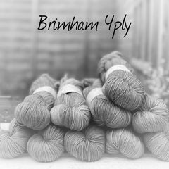 Black and white image of skeins of yarn with "Brimham 4ply" overlaid in black text