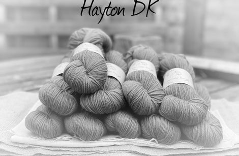 Black and white image of skeins of yarn with "Hayton DK" overlaid in black text