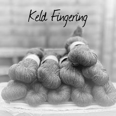 Black and white image of skeins of yarn with "Keld Fingering" overlaid in black text