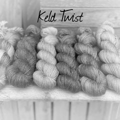 A black and white image of six skeins of yarn in different shades. "Keld Twist" is written at the top of the image.
