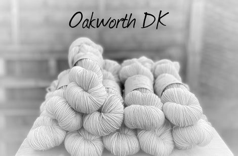 Black and white image of skeins of yarn with "Oakworth DK" overlaid in black text