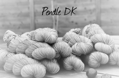 Black and white image of skeins of yarn with "Pendle DK" overlaid in black text