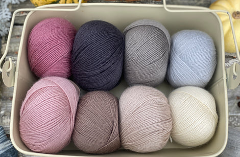 Eight balls of Milburn 4ply in shades of pink, brown and grey