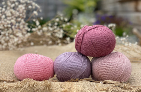 Four balls of Milburn in shades of pink and purple