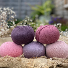 Five balls of Milburn in shades of pink and purple