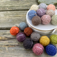 19 small balls of yarn 