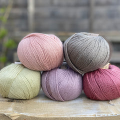 Five balls of Milburn in pink, purple, grey and green